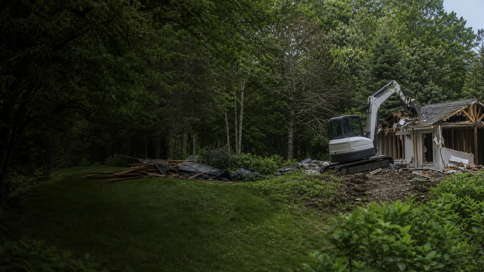 Demolition equipment and debris hauling at a Brighton, Michigan property